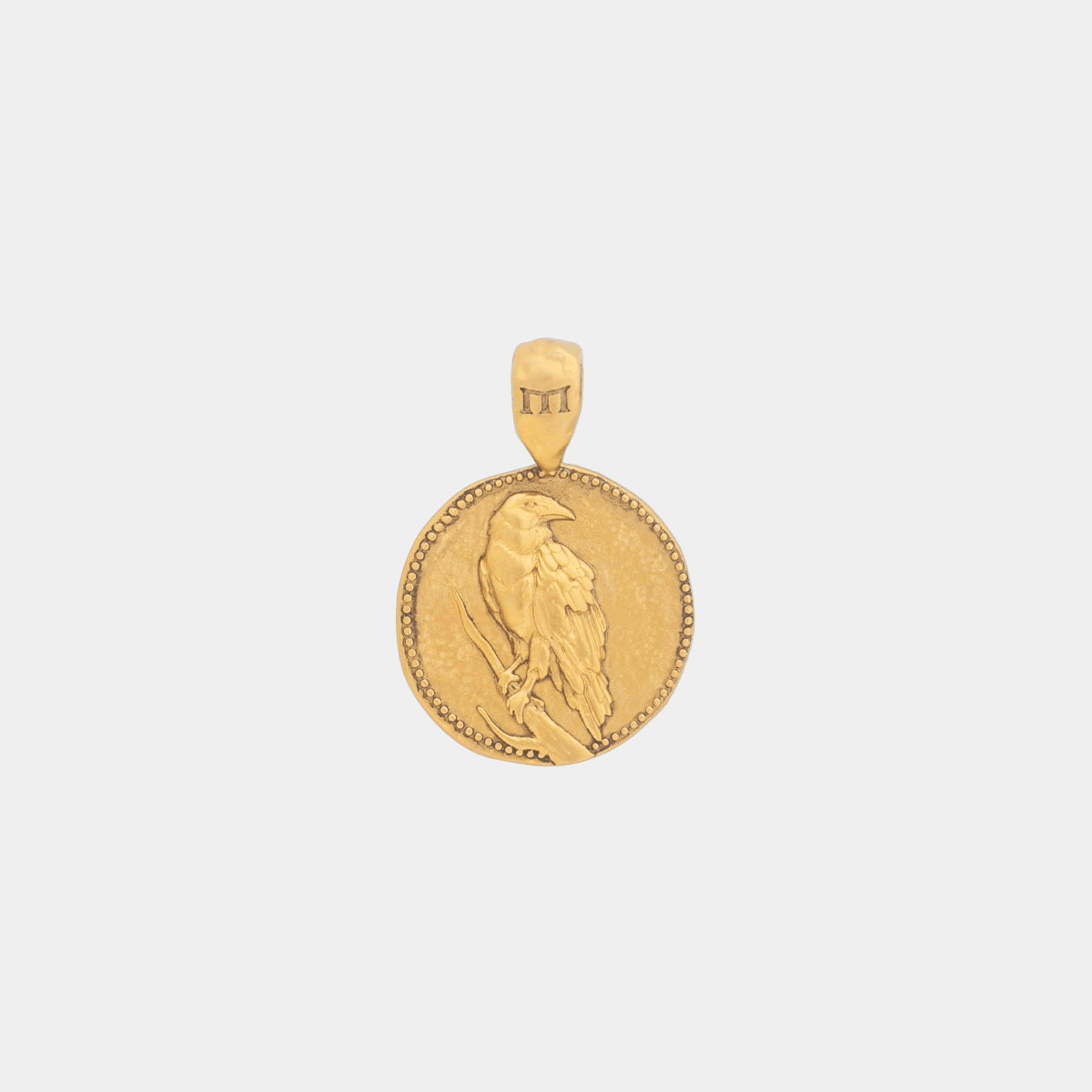 Gold raven pendant on sale